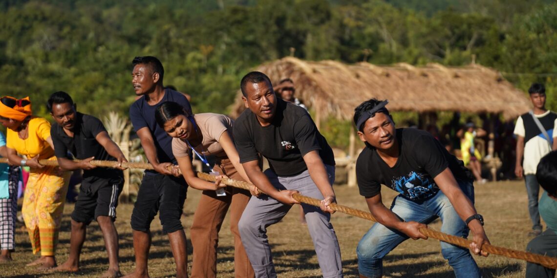 People take part in the game of tug-of-war at the Megong Festival, in Garo Hills.