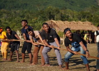 People take part in the game of tug-of-war at the Megong Festival, in Garo Hills.