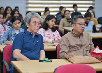 Eminent poet and NEHU teacher Robin Ngangom (right) during a session at Dibrugarh University International Literary Festival on Thursday
