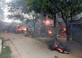 A file photo of burning houses at