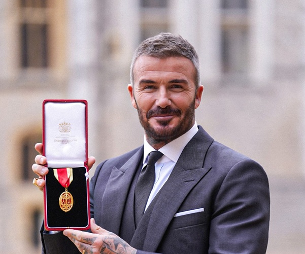 Sir David Beckham: Football icon receives knighthood from King at Windsor Castle